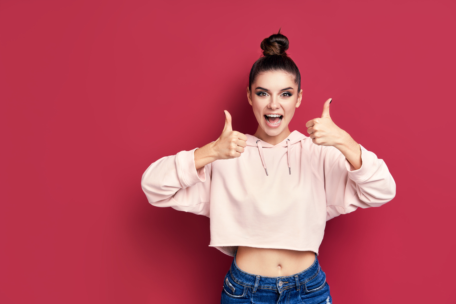 Happy Woman Showing Thumbs Up Gesture